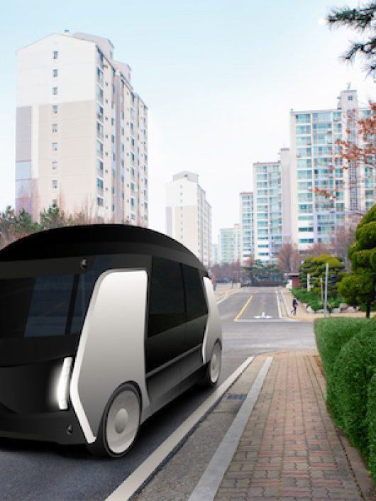 Futuristic autonomous bus on the city street.